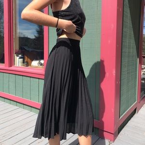 Long black pleated skirt